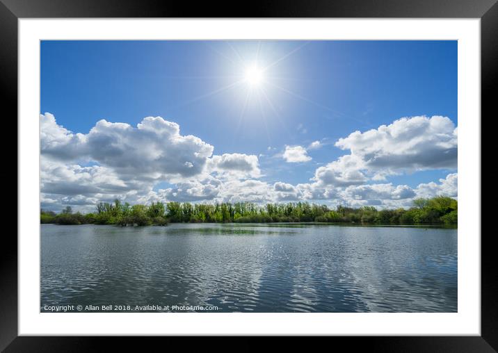 Sun Star over Trees and Lake Framed Mounted Print by Allan Bell