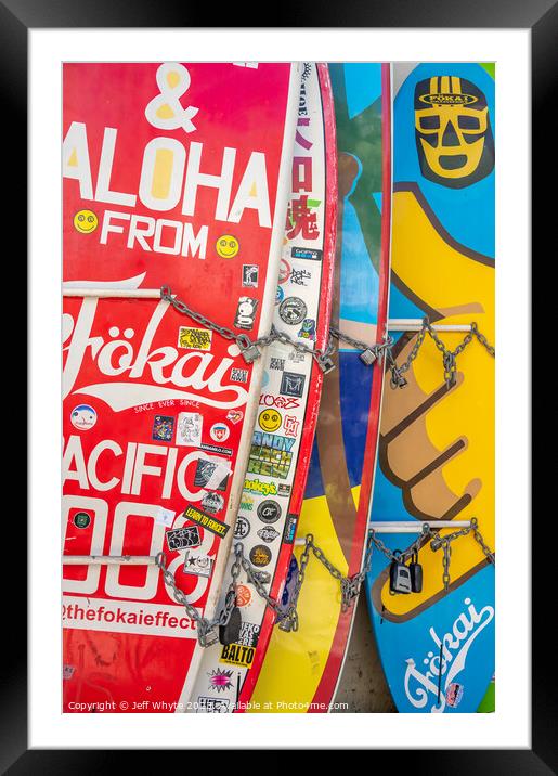Surfboards lined up in storage at Waikiki Framed Mounted Print by Jeff Whyte