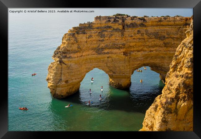 Kayaks and sup boards peddling under the Arco Natural on the Algarve coast in Portugal. Framed Print by Kristof Bellens