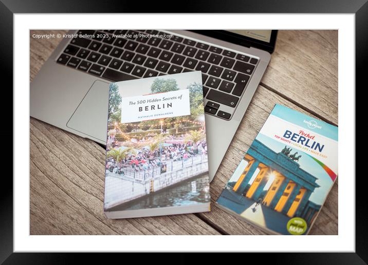Planning a trip to Berlin with laptop on wooden table and travel guides Framed Mounted Print by Kristof Bellens