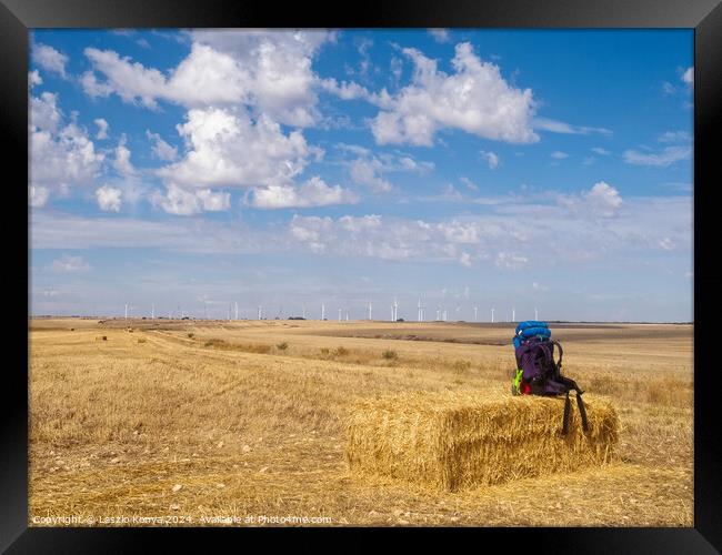 Backpack on a haystack -  Hornillos del Camino  Framed Print by Laszlo Konya