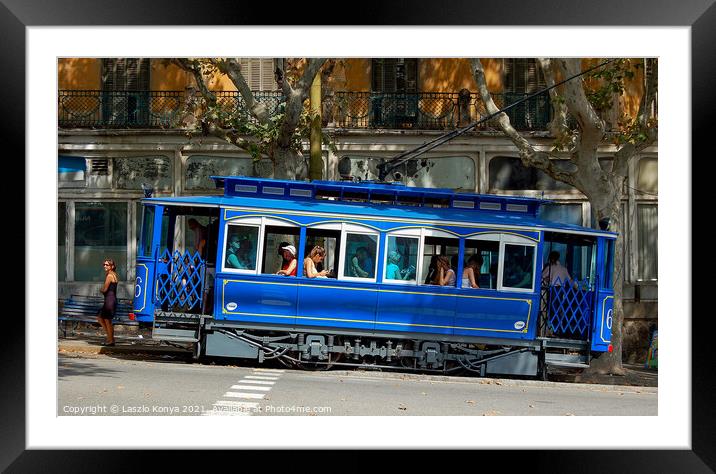 Blue Tram - Barcelona Framed Mounted Print by Laszlo Konya