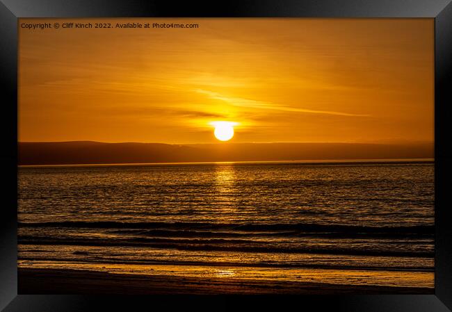 Sunset over the beach Framed Print by Cliff Kinch