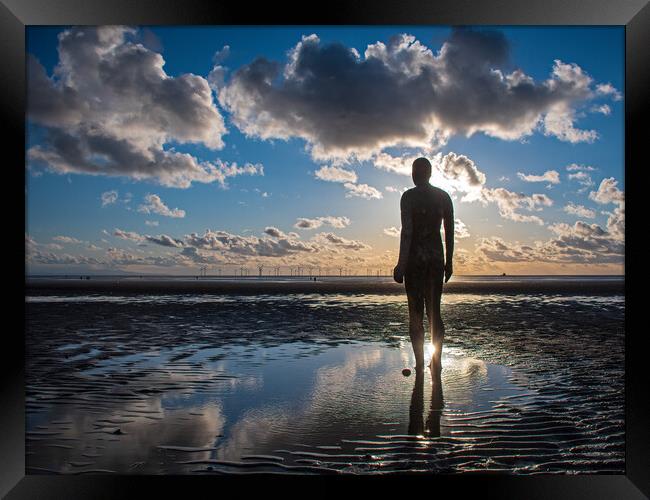 Anthony Gormley statue in a body of water , Crosby Framed Print by Vicky Outen