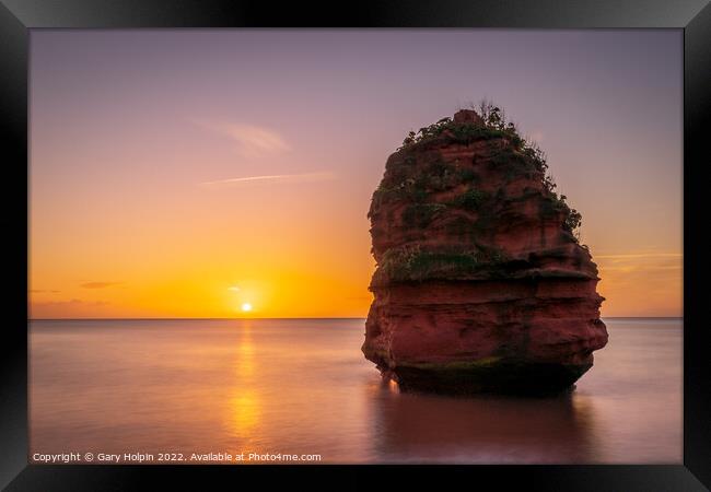 Sunrise at the sea stack Framed Print by Gary Holpin