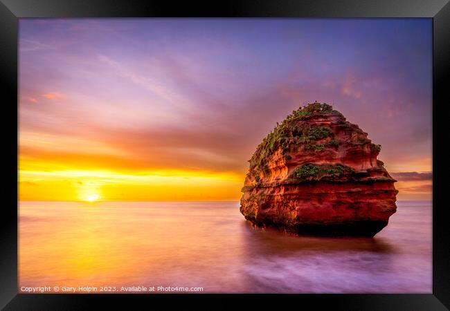 Sunrise at the sea stack Framed Print by Gary Holpin