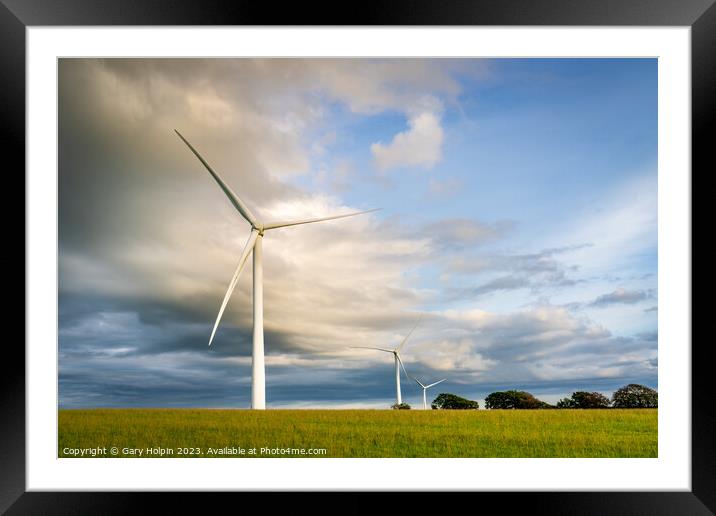Wind turbines at sunset Framed Mounted Print by Gary Holpin