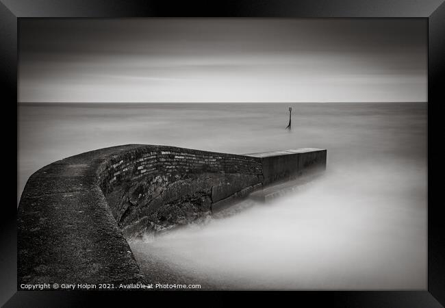 High tide at the breakwater Framed Print by Gary Holpin
