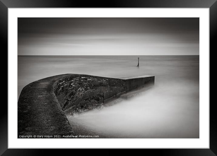 High tide at the breakwater Framed Mounted Print by Gary Holpin