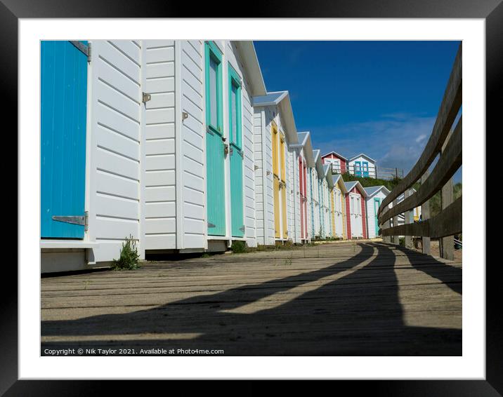 Beach huts Framed Mounted Print by Nik Taylor
