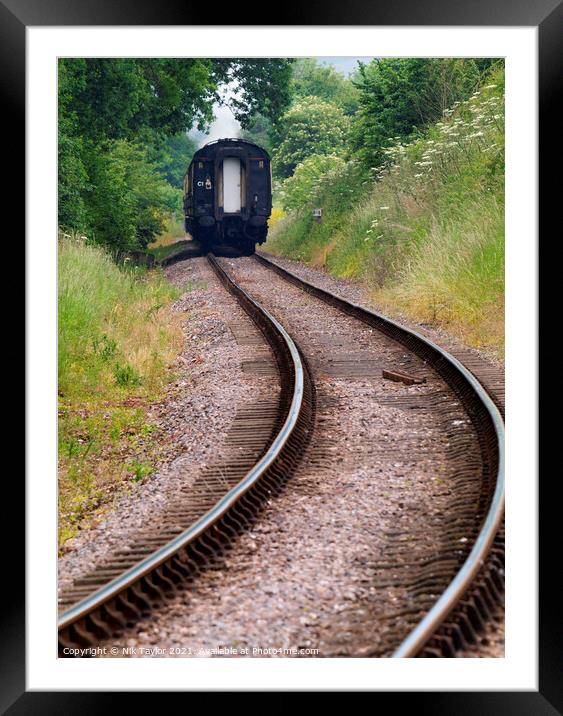 Train disappearing along the track Framed Mounted Print by Nik Taylor