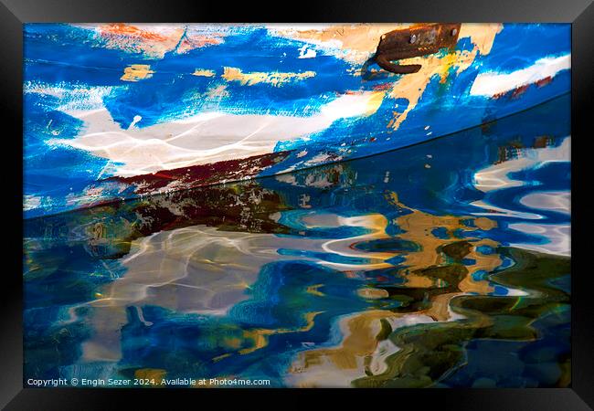 Abstract reflections of an old colorful wooden fishing boat on sea surface Framed Print by Engin Sezer