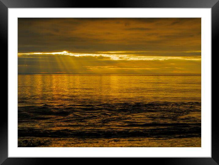 Golden sunset with sun rays Framed Mounted Print by Rory Hailes
