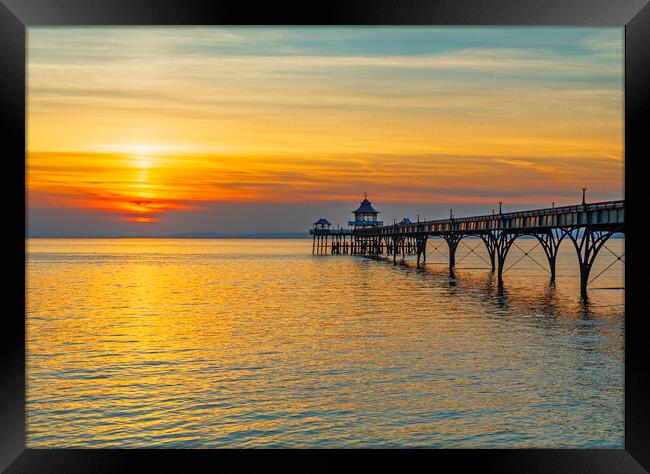 Clevedon Pier with a golden sunset Framed Print by Rory Hailes
