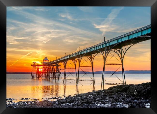 Clevedon Pier on a bright evening with colourful reflections Framed Print by Rory Hailes