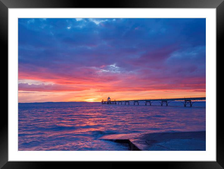 Clevedon Pier at sunset with a pinkish hue Framed Mounted Print by Rory Hailes