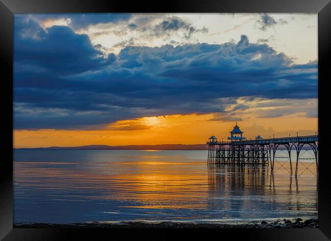 Clevedon Pier at sunset on a calm and cloud evening Framed Print by Rory Hailes