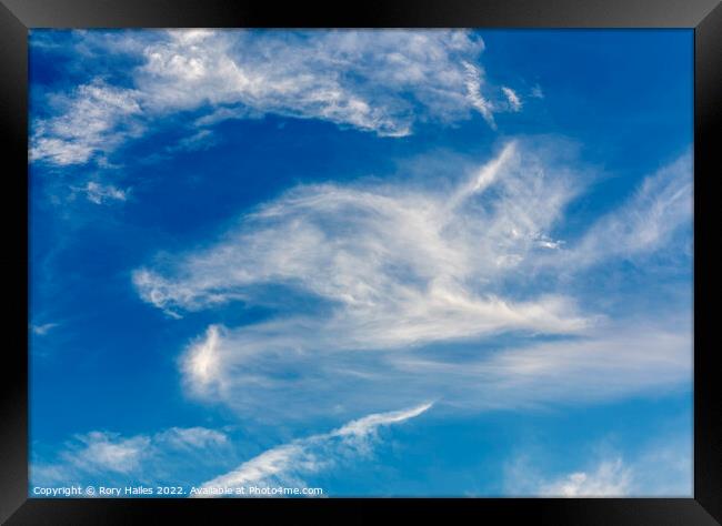 Cirrus clouds against a blue sky Framed Print by Rory Hailes