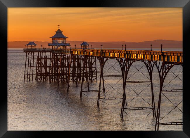 Clevedon pier at sunset Framed Print by Rory Hailes