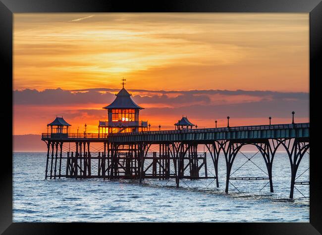 Clevedon Pier with the sun behind the pagoda Framed Print by Rory Hailes