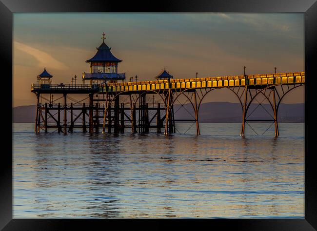 Clevedon Pier with the side panels catching some sunlight Framed Print by Rory Hailes