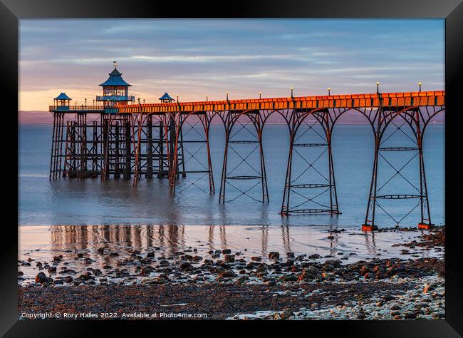 Clevedon Pier at sunset with a low tide Framed Print by Rory Hailes