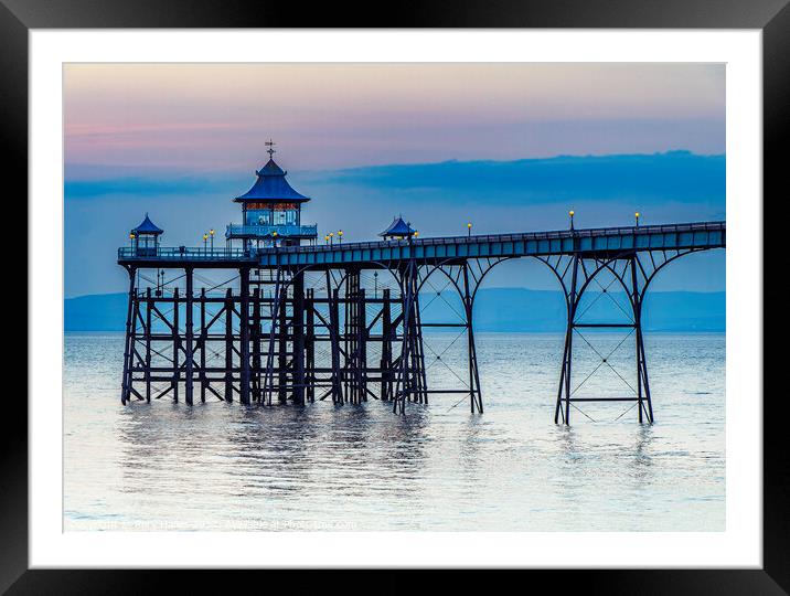 Clevedon Pier on a calm evening with a slight bluish hue Framed Mounted Print by Rory Hailes