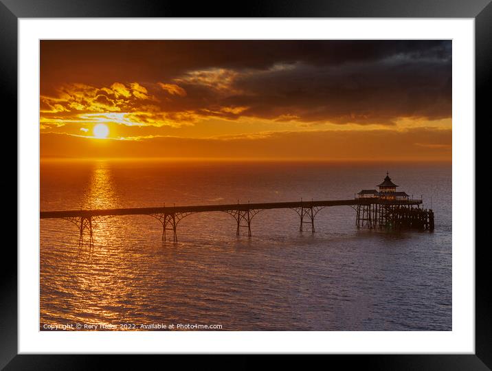 Clevedon Pier at sunset just before the sun disapp Framed Mounted Print by Rory Hailes