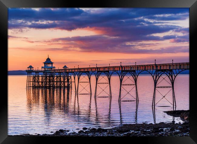 Clevedon Pier at Sunset with a slight pinkish hue Framed Print by Rory Hailes