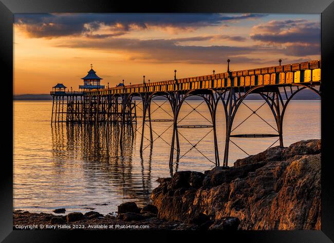 Clevedon Pier at Sunset with the pier side panels catching the sunlight Framed Print by Rory Hailes