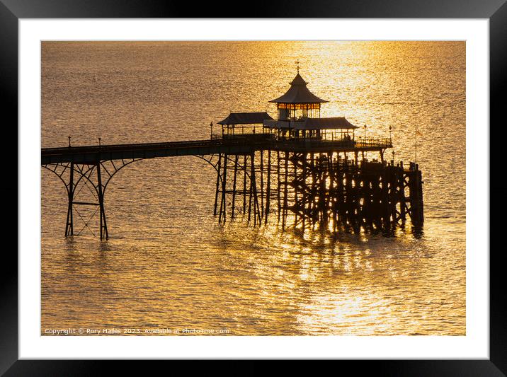 Clevedon Pier at sunset with a calm sea Framed Mounted Print by Rory Hailes