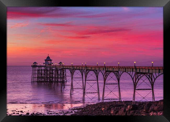 Clevedon Pier at sunset at low tide Framed Print by Rory Hailes