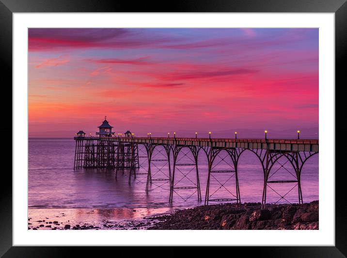 Clevedon Pier at sunset at low tide Framed Mounted Print by Rory Hailes