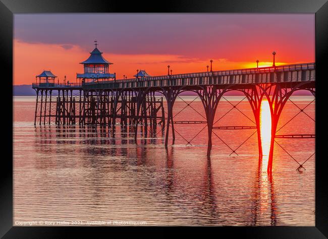 Clevedon Pier with a streak of sunlight Framed Print by Rory Hailes