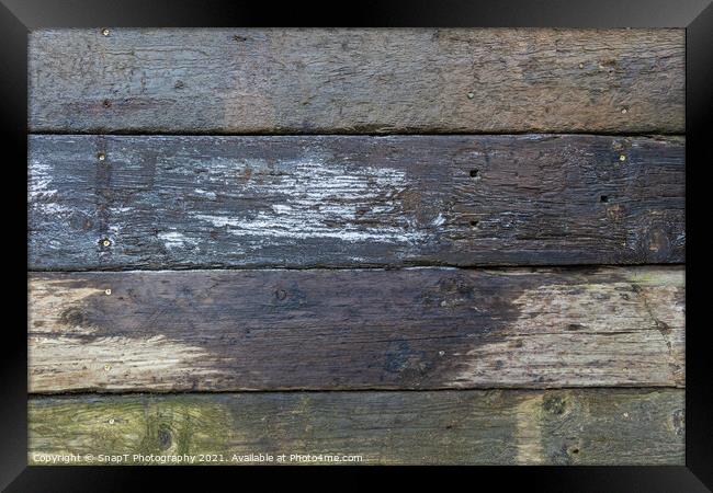 Abstract background of damp stacked wooden railway sleepers covered with frost Framed Print by SnapT Photography
