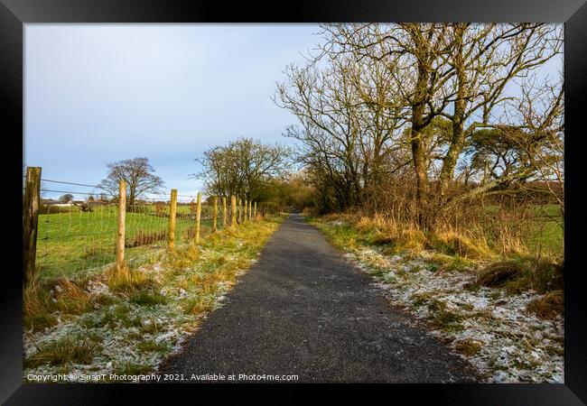 A frosty countryside trail, with snow on the ground, Scotland Framed Print by SnapT Photography