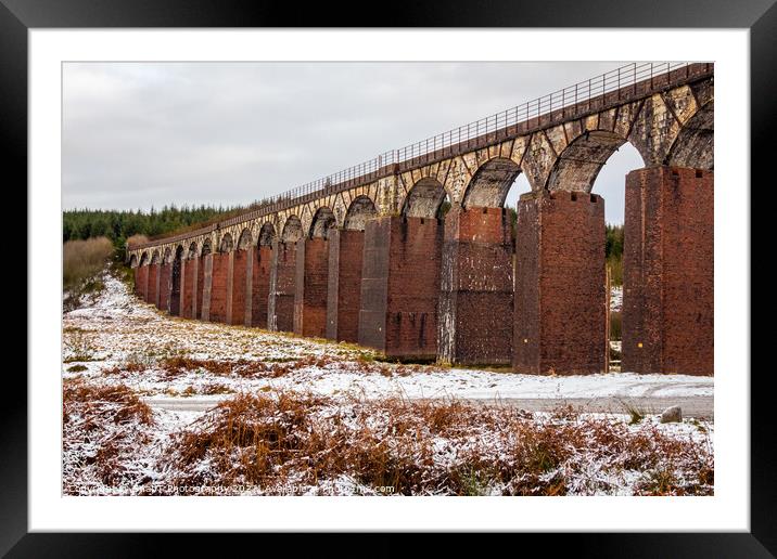 A snow covered landscape at the old railway viaduct at the Big Water of Fleet Framed Mounted Print by SnapT Photography