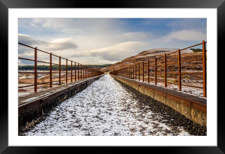 A snow covered old railway viaduct at the Big Water of Fleet at the Cairnsmore Framed Mounted Print by SnapT Photography