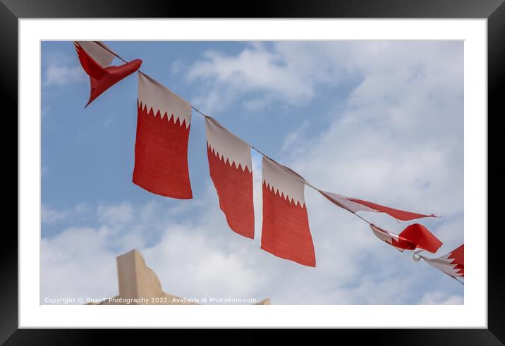Al-Adaam national flags of Qatar flying in the sky above Doha, Qatar Framed Mounted Print by SnapT Photography