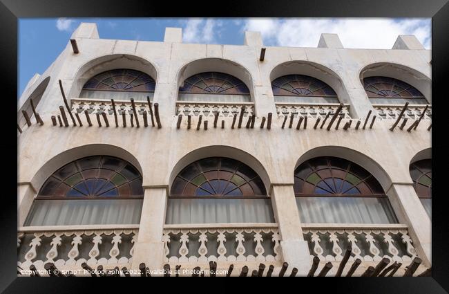 Qatari architecture in Souq Waqif, with bamboo poles, stain glass and arches Framed Print by SnapT Photography