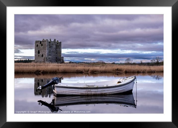Boat moored on the river dee with Threave Castle in the background, Scotland Framed Mounted Print by SnapT Photography