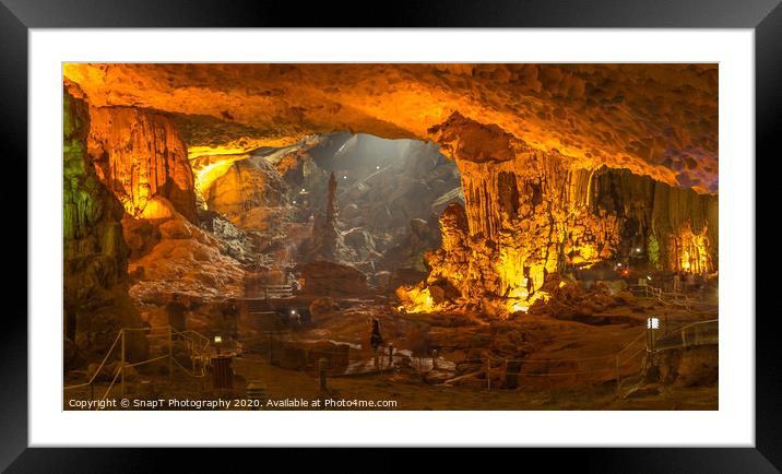 The illuminated limestone Sung Sot caves in the UNESCO World Heritage Site of Ha Long Bay in Northern Vietnam. Framed Mounted Print by SnapT Photography