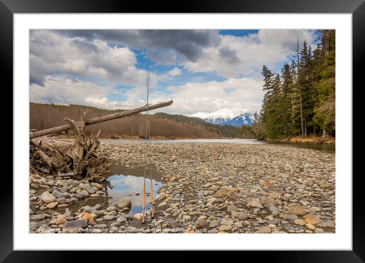 Two fly fishing rods on a dead tree on a river in British Columbia Framed Mounted Print by SnapT Photography