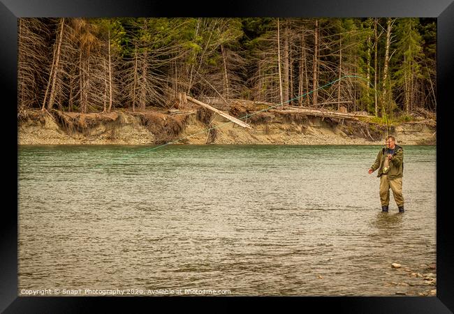 A man hooked into a fish while fly fishing in British Columbia, near Kitimat Framed Print by SnapT Photography