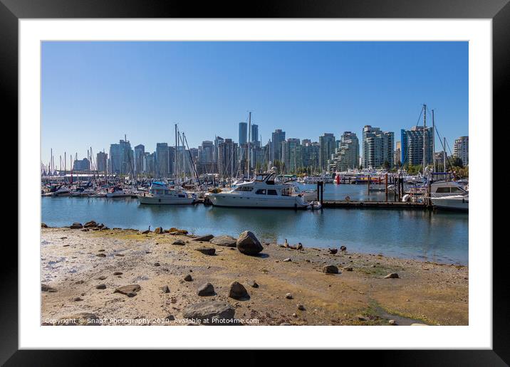 The Vancouver skyline across Coal Harbour from the sea wall on Stanley Park Framed Mounted Print by SnapT Photography