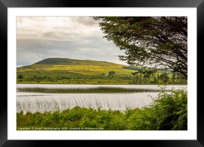 A view of Loch Stroan with a reed bed and the hill Framed Mounted Print by SnapT Photography