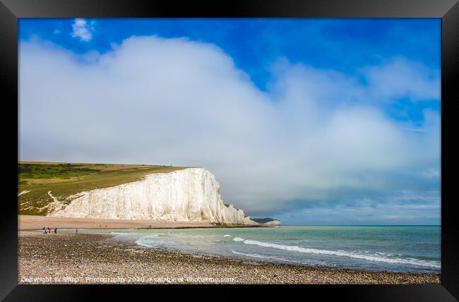 Dramatic white cliffs, blue sky and shingle beach  Framed Print by SnapT Photography