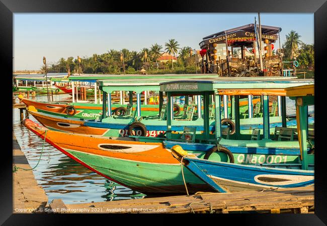 Colorful Vietnamese traditional boats, moored on the harbour wall, Hoi An, Vietnam - January 10th, 2015 Framed Print by SnapT Photography