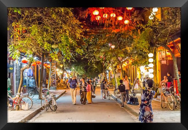 Le loi street at night, with lanterns, trees and suit shops, Hoi An, Vietnam - January 10th, 2015 Framed Print by SnapT Photography