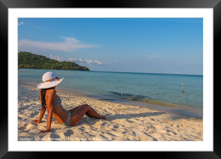 A female asian model relaxing in the sun on Sao Be Framed Mounted Print by SnapT Photography